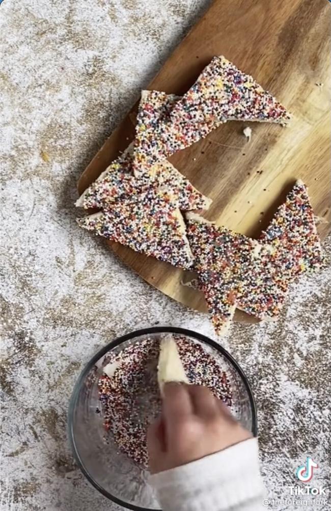 The US food blogger decided to cut off the crusts in the fair bread demo. Picture: TikTok/@theforeignfork.