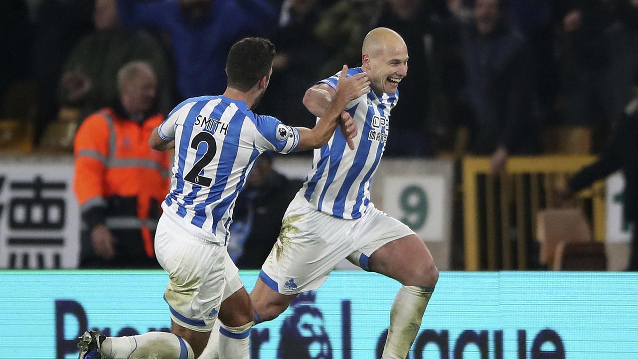 Huddersfield Town's Aaron Mooy, right, celebrates scoring his side's second goal