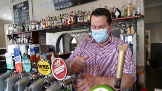 Cameron Johns clears the beer lines in the Swan Hotel in Richmond. Picture: David Crosling