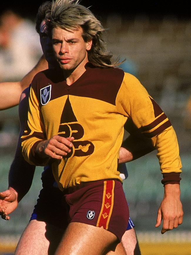 Warwick Capper models a rare long sleeved Brisbane Bears guernsey.