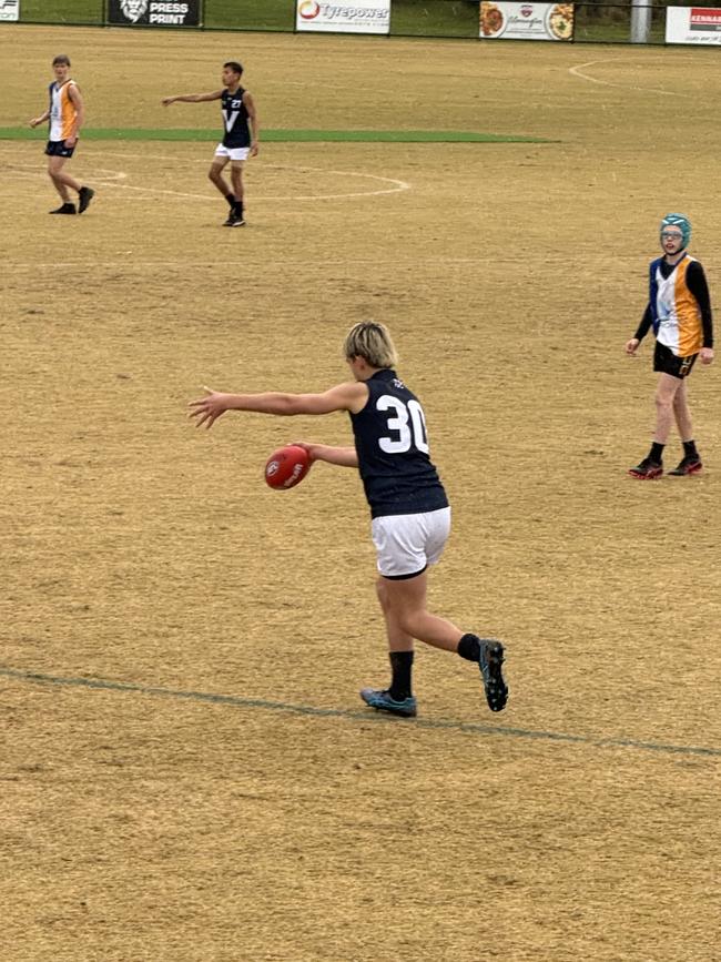 Chevy McBride takes a kick.