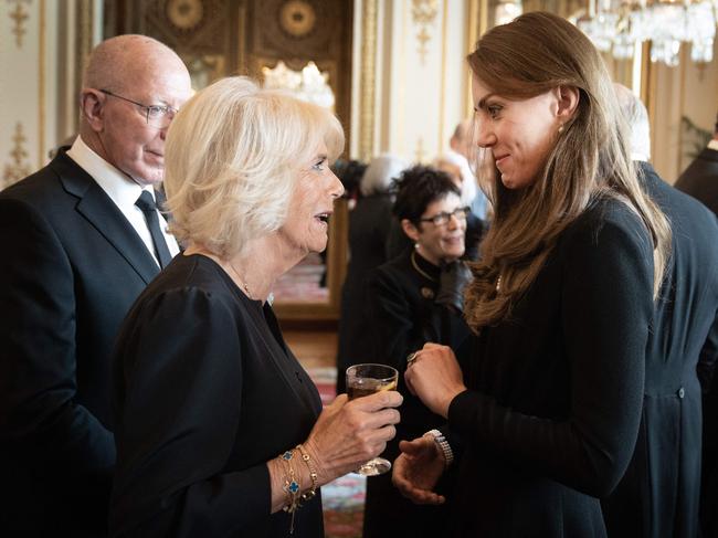 Queen Consort speaks with Princess Catherine as the Commonwealth’s governors-general watch on. Picture: AFP