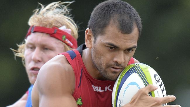 Karmichael Hunt attempts to break away from the defence.