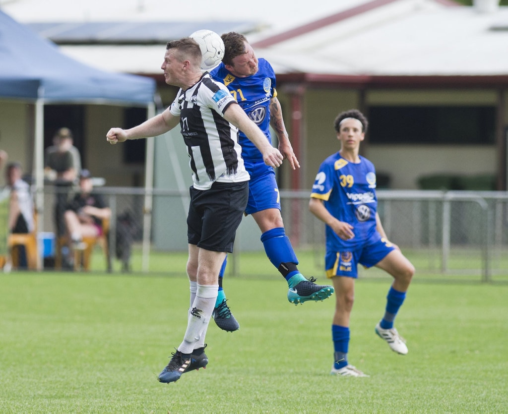 Benjamin Barrowclift, Willowburn and Ashley Freier, USQ. Football, Willowburn vs USQ. Sunday, 4th Mar, 2018. Picture: Nev Madsen