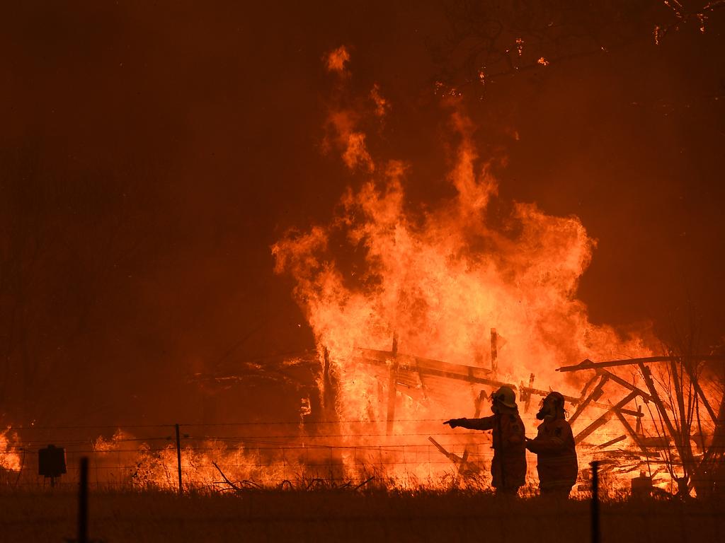 NSW Rural Fire Service crews fight the Gospers Mountain Fire as it impacts a structure at Bilpin, Saturday, December 21, 2019. Conditions are expected to worsen across much of NSW as temperatures tip 40C. Picture: AAP / Dan Himbrechts