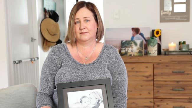 Mia Bannister at home with pictures of her late son Oliver Hughes, 14. Picture: Liam Kidston