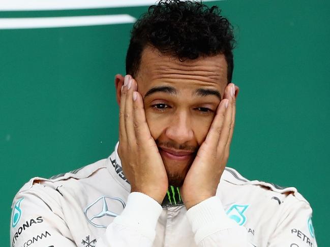 SAO PAULO, BRAZIL - NOVEMBER 13: Lewis Hamilton of Great Britain and Mercedes GP celebrates his win on the podium during the Formula One Grand Prix of Brazil at Autodromo Jose Carlos Pace on November 13, 2016 in Sao Paulo, Brazil. (Photo by Clive Mason/Getty Images)