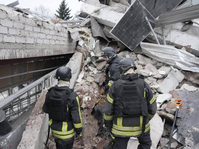 This handout photograph published on December 11, 2024, on the official Telegram channel of the head of the Zaporizhzhia Regional Military Administration Ivan Fedorov, shows rescuers searching for people under the rubble of a medical clinic destroyed by a missile in the city of Zaporizhzhia, amid the Russian invasion of Ukraine. A Russian strike on December 10, 2024, killed eight people and wounded 22 others including a five-year-old girl in the southern Ukrainian city of Zaporizhzhia. (Photo by Handout / Telegram / @ivan_fedorov_zp / AFP) / RESTRICTED TO EDITORIAL USE - MANDATORY CREDIT "AFP PHOTO /official Telegram channel of the head of the Zaporizhzhia Regional Military Administration Ivan Fedorov  " - NO MARKETING NO ADVERTISING CAMPAIGNS - DISTRIBUTED AS A SERVICE TO CLIENTS