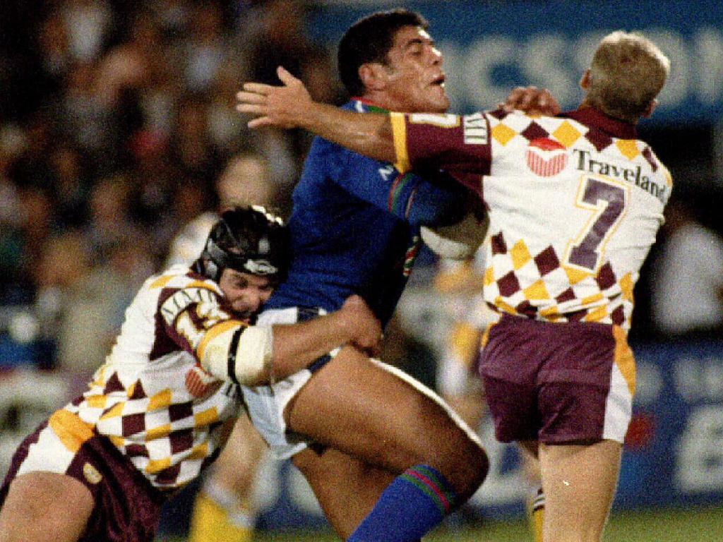 Stephen Kearney is tackled during the 1995 match between the Broncos and Warriors. Picture: Rugby League A/CT