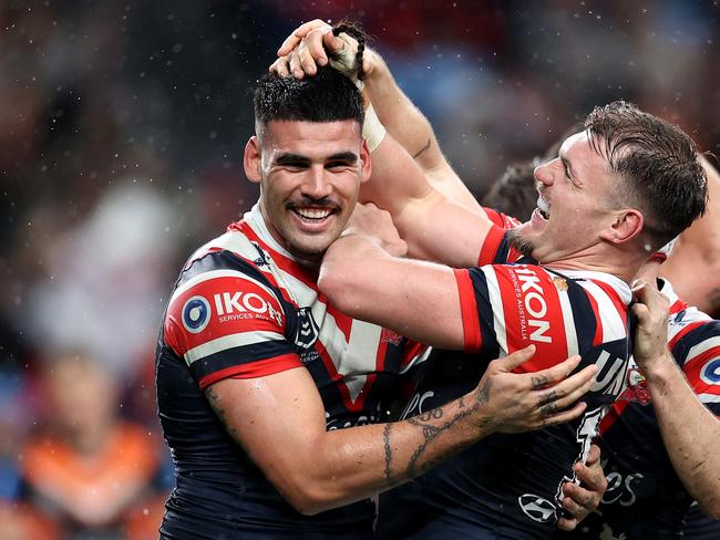 SYDNEY, AUSTRALIA - JUNE 30: Terrell May of the Roosters celebrates with team mates after scoring a try during the round 17 NRL match between Sydney Roosters and Wests Tigers at Allianz Stadium, on June 30, 2024, in Sydney, Australia. (Photo by Brendon Thorne/Getty Images)