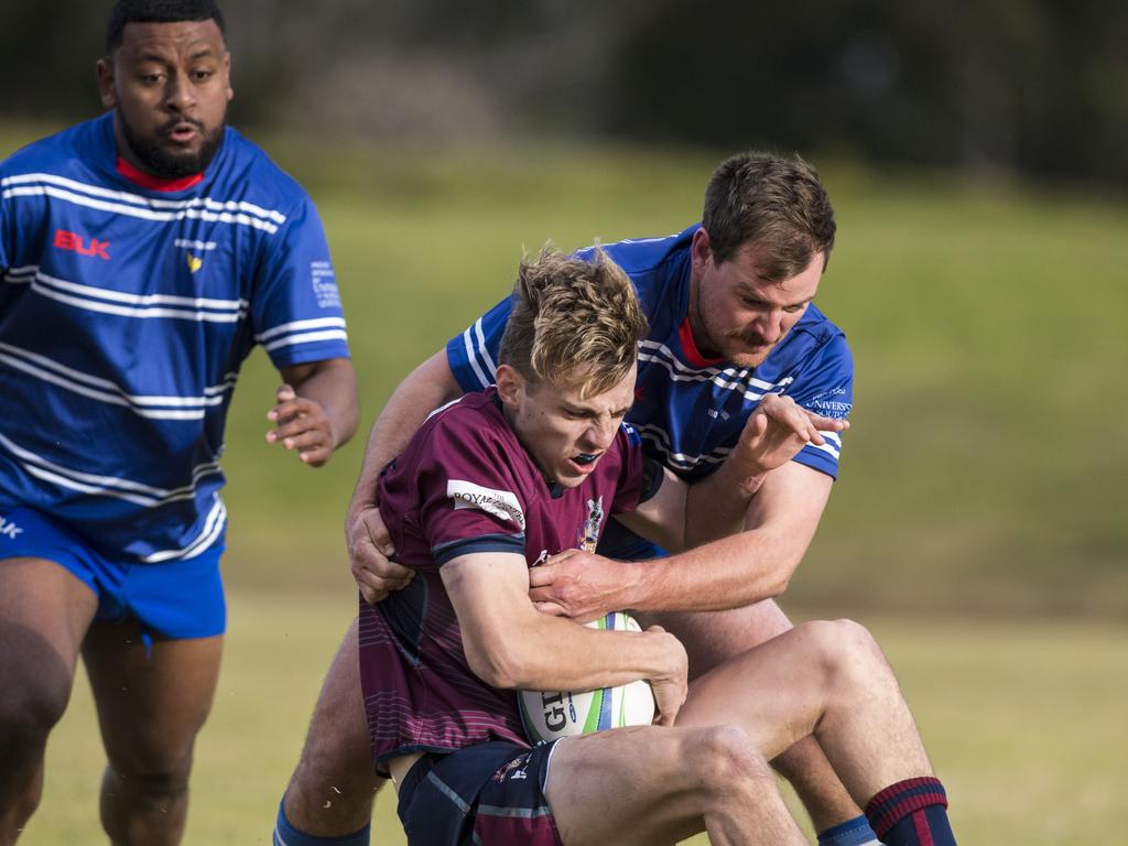 Alex Mundell of Toowoomba Bears is tackled by USQ in Downs Rugby Risdon Cup round 11 rugby union at USQ, Saturday, June 19, 2021. Picture: Kevin Farmer