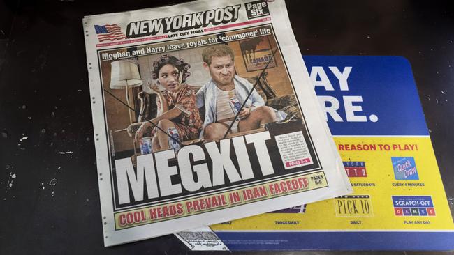 Prince Harry and his wife, Meghan, are characterized on Page 1 of the New York Post, Thursday, Jan. 9, 2020,  in New York. In a statement the couple said they are planning "to step back" as senior members of the royal family and "work to become financially independent."  (AP Photo/Mark Lennihan)