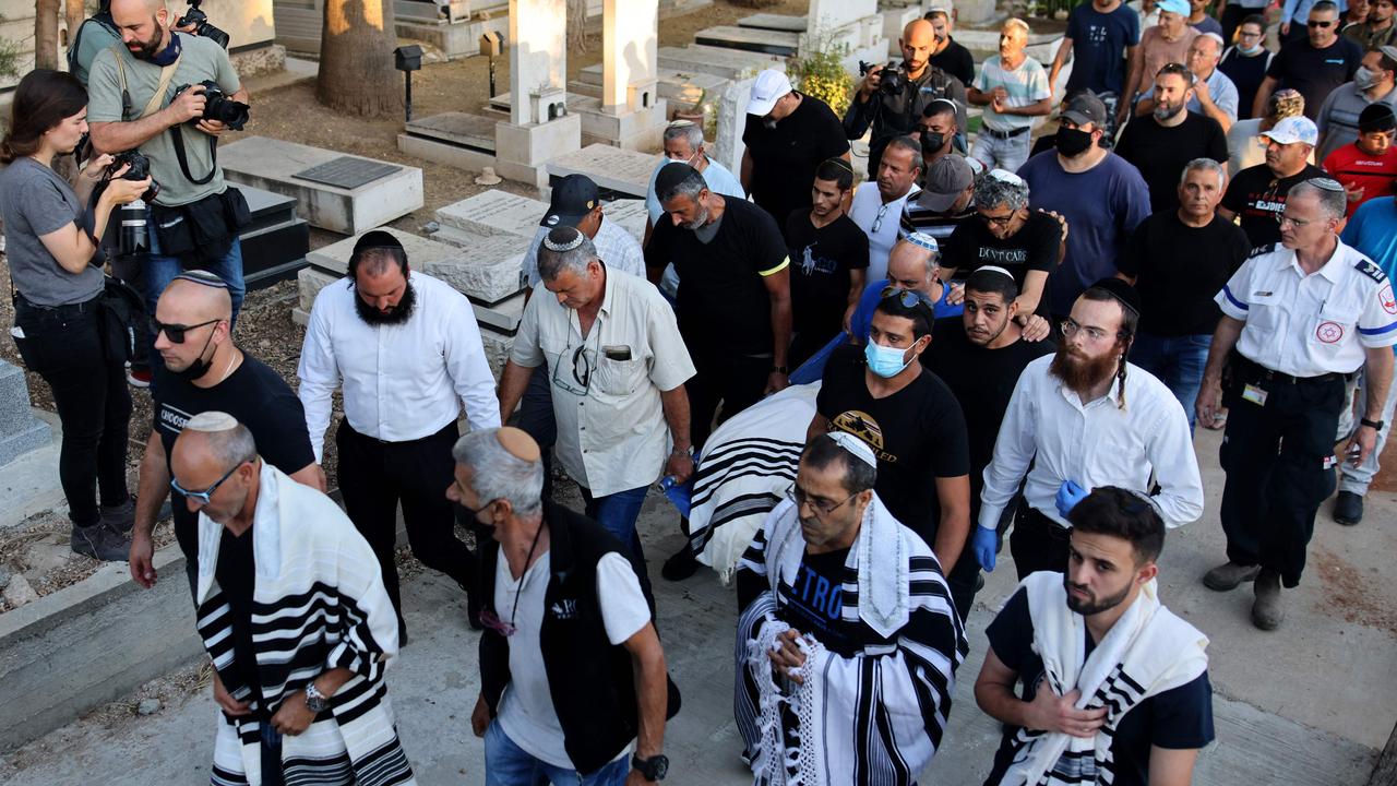 Israeli mourners attend the funeral of Yigal Yehoshua in the city of Modiin, the 56-year-old Israeli man who was beaten by Arab suspects in the city of Lod last week. Picture: AFP