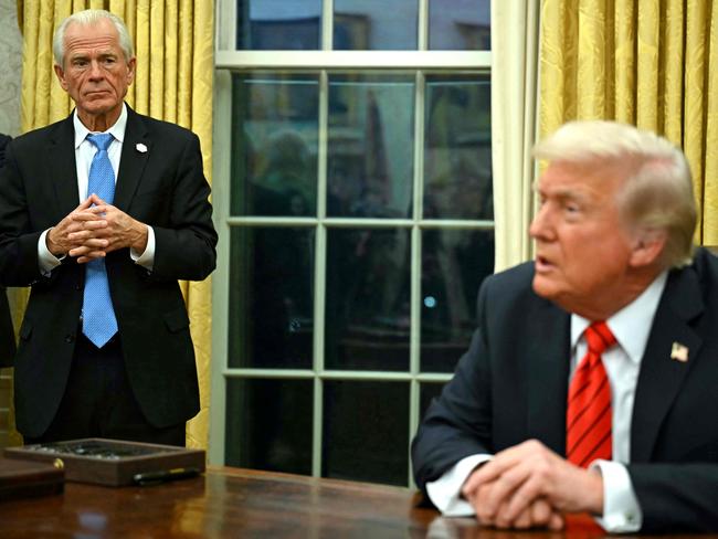 Donald Trump’s senior counsellor for trade Peter Navarro watches as the President announces his new metal tariffs. Picture: AFP