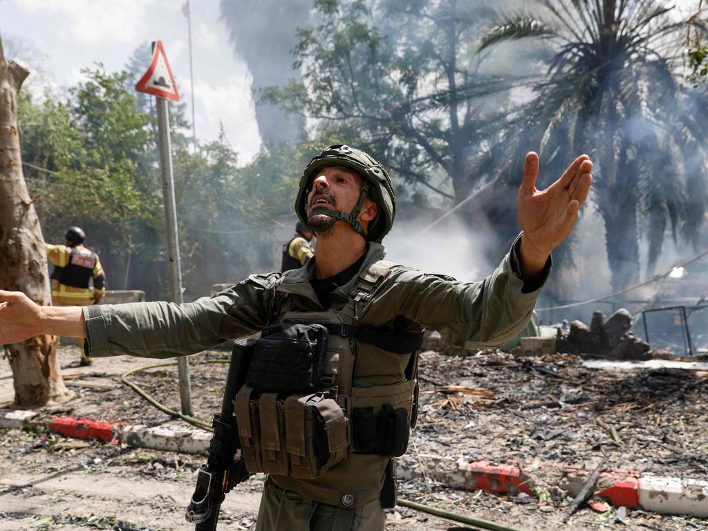 Security forces and emergency personnel deploy at a site hit by rockets fired from southern Lebanon in the northern Israeli city of Kyriat Shmona near the Lebanese border. Picture: AFP