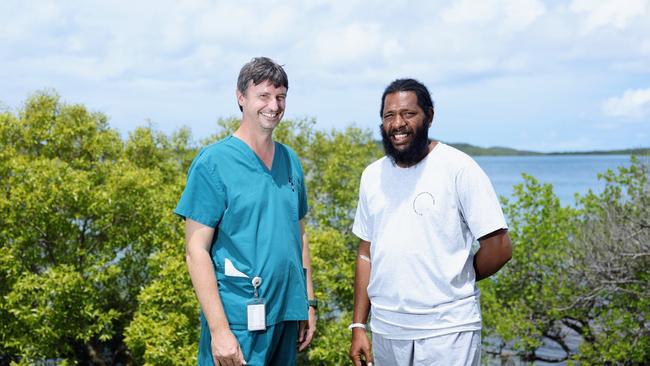 Senior medical officer at the Thursday Island Hospital Dr Adam Holyoak is thanked by Adea Tabuai, who was airlifted to safety from rough seas in the Torres Strait after his dinghy capsized. Picture: Brendan Radke