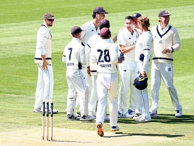 MELBOURNE, AUSTRALIA - OCTOBER 21: Scott Boland of Victoria is congratulated by team mates after taking the wicket of Sam Konstas of New South Wales during the Sheffield Shield match between Victoria and New South Wales at Melbourne Cricket Ground, on October 21, 2024, in Melbourne, Australia. (Photo by Josh Chadwick/Getty Images)