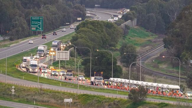 Driver delays: The COVID-19 check point queue at Albury, where truck drivers will now have to prove they have been tested for COVID-19. Picture: Simon Dallinger