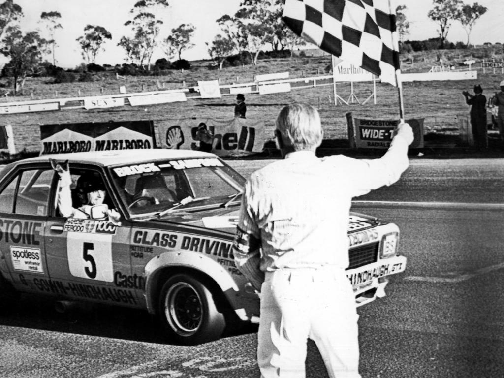 Peter Brock driving private entry Holden Torana SLR crosses the finish line for his second Hardie Ferodo 1000 win at Mount Panorama at Bathurst in 1975. Picture: Ken Matts/News Corp Australia