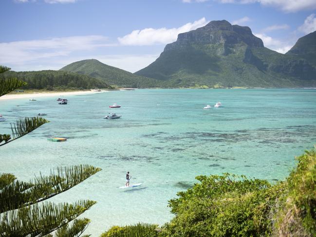 Man stand up paddleboarding off Lagoon Beach with views across to Mount Lidgbird. Lord Howe Islandcredit Tom Archerescape december 6 2020 top gear