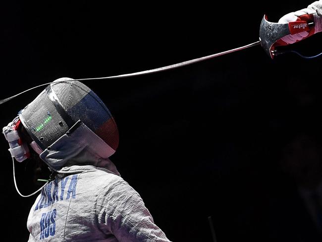 Russia's Sofya Velikaya (L) competes against Russia's Yana Egorian during the women’s individual sabre gold medal bout as part of the fencing event of the Rio 2016 Olympic Games, on August 8, 2016, at the Carioca Arena 3, in Rio de Janeiro. / AFP PHOTO / Kirill KUDRYAVTSEV
