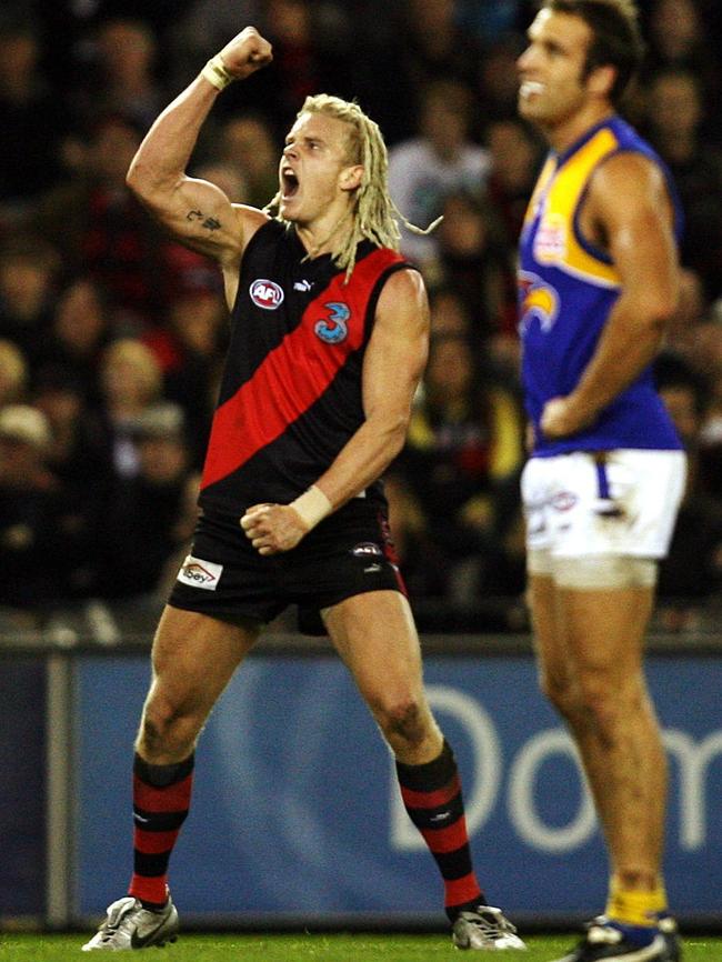 Courtney Johns celebrates a goal against Chris Judd’s Eagles.