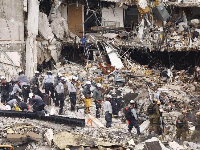 Search and rescue teams look for possible survivors and remains in the partially collapsed 12-story Champlain Towers South condo building. Picture: AFP