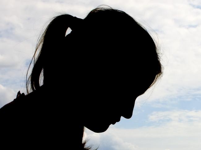 silhouette of female with sky