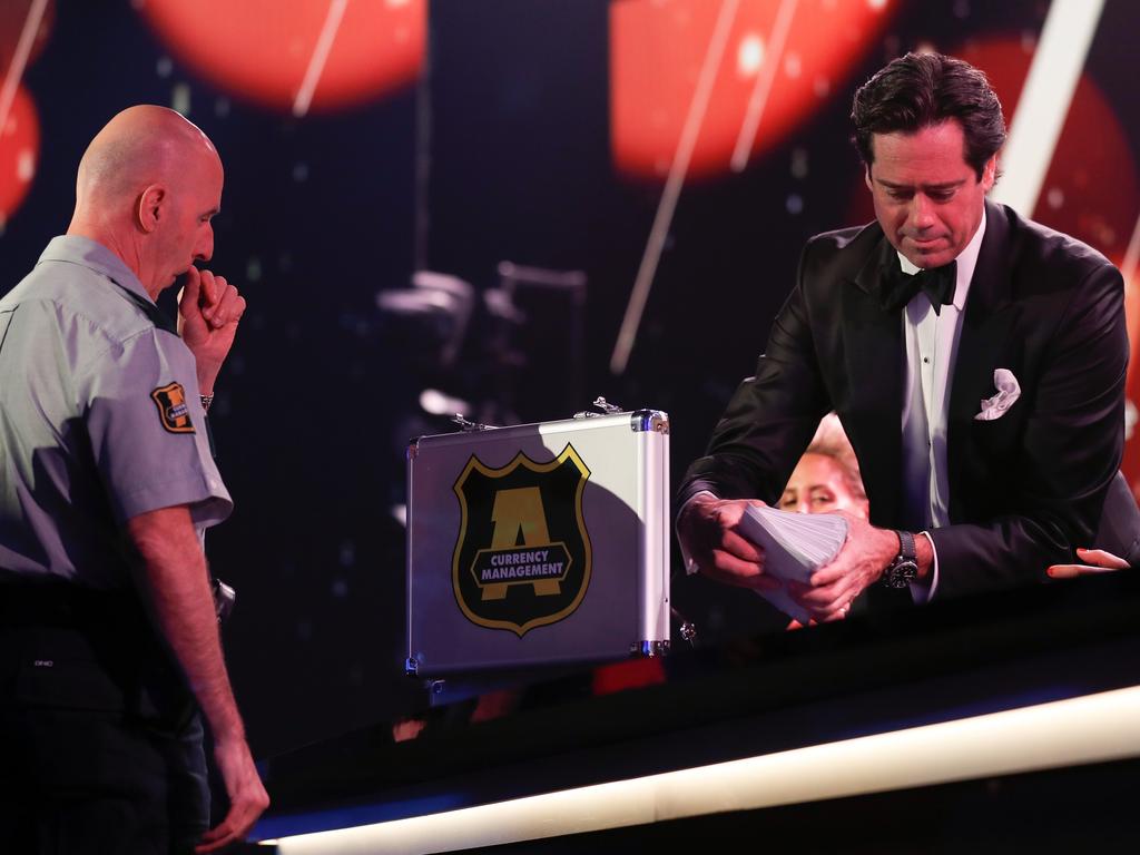 AFL boss Gillon McLachlan receives the 2022 Brownlow Medal votes from Armaguard. Picture: AFL Photos/Getty Images