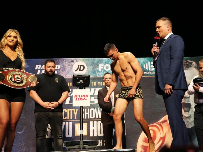 Tszyu steps up on the scales at the weigh-in at Newcastle’s Civic Theatre. Picture: NCA NewsWire