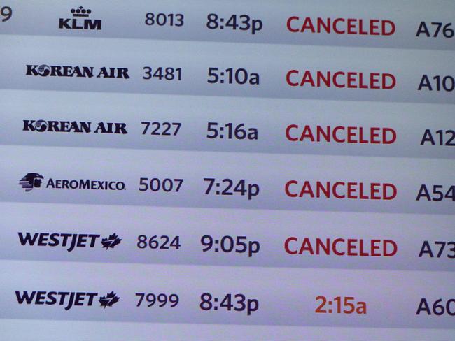 A departure board shows canceled flights in the McNamara terminal at the Detroit Metropolitan Wayne County Airport on July 20, 2024, in Detroit, Michigan. Picture: AFP