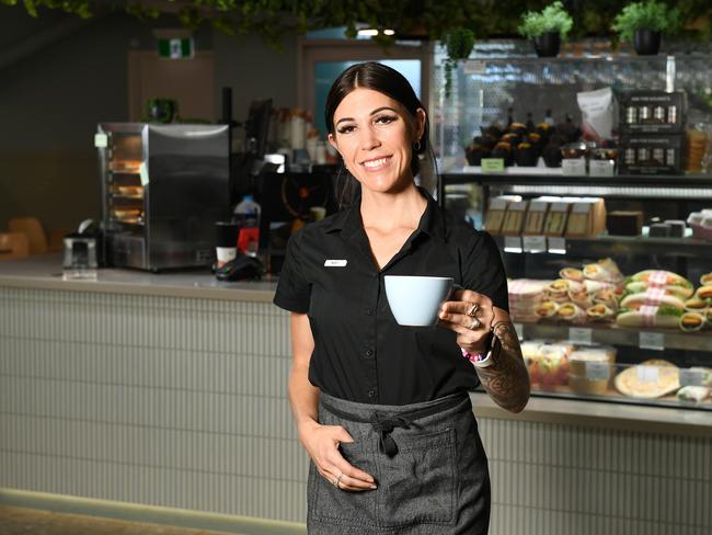 Airport cafe team member Natalie Bennet has had a busy month of work in July as record passenger numbers came through Townsville Airport. Picture: Shae Beplate.