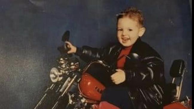 Jerry Lee Gardner as a child on a motorbike.