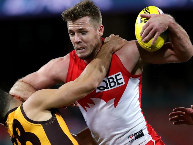 Hawthorn's Paul Puopolo tackles Sydney's Luke Parker during the AFL match Sydney Swans v Hawthorn Hawks at the SCG. Picture. Phil Hillyard