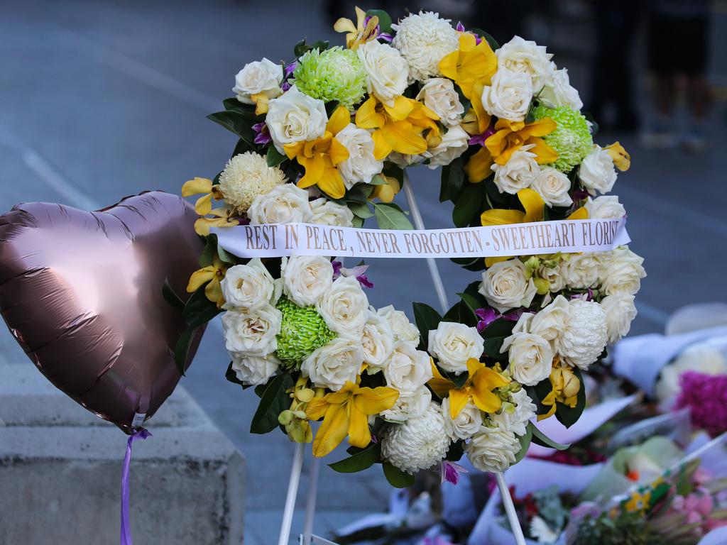 People have placed tributes at the shopping centre since Sunday morning. Picture: NCA NewsWire / Gaye Gerard