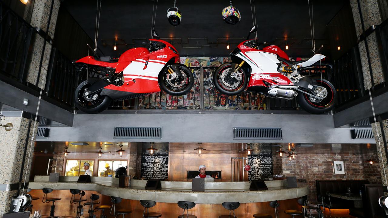 Motorbike hang from the ceiling of Criniti's in Woolloomooloo, Sydney.