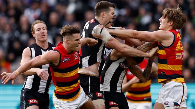 Ben Keays removes Mason Cox’s glasses. Picture: Michael Willson/AFL Photos via Getty Images