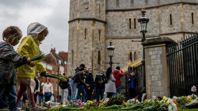 WINDSOR, ENGLAND – APRIL 10: People arrive at Windsor Castle to leave floral tributes to Prince Philip. Picture: Getty