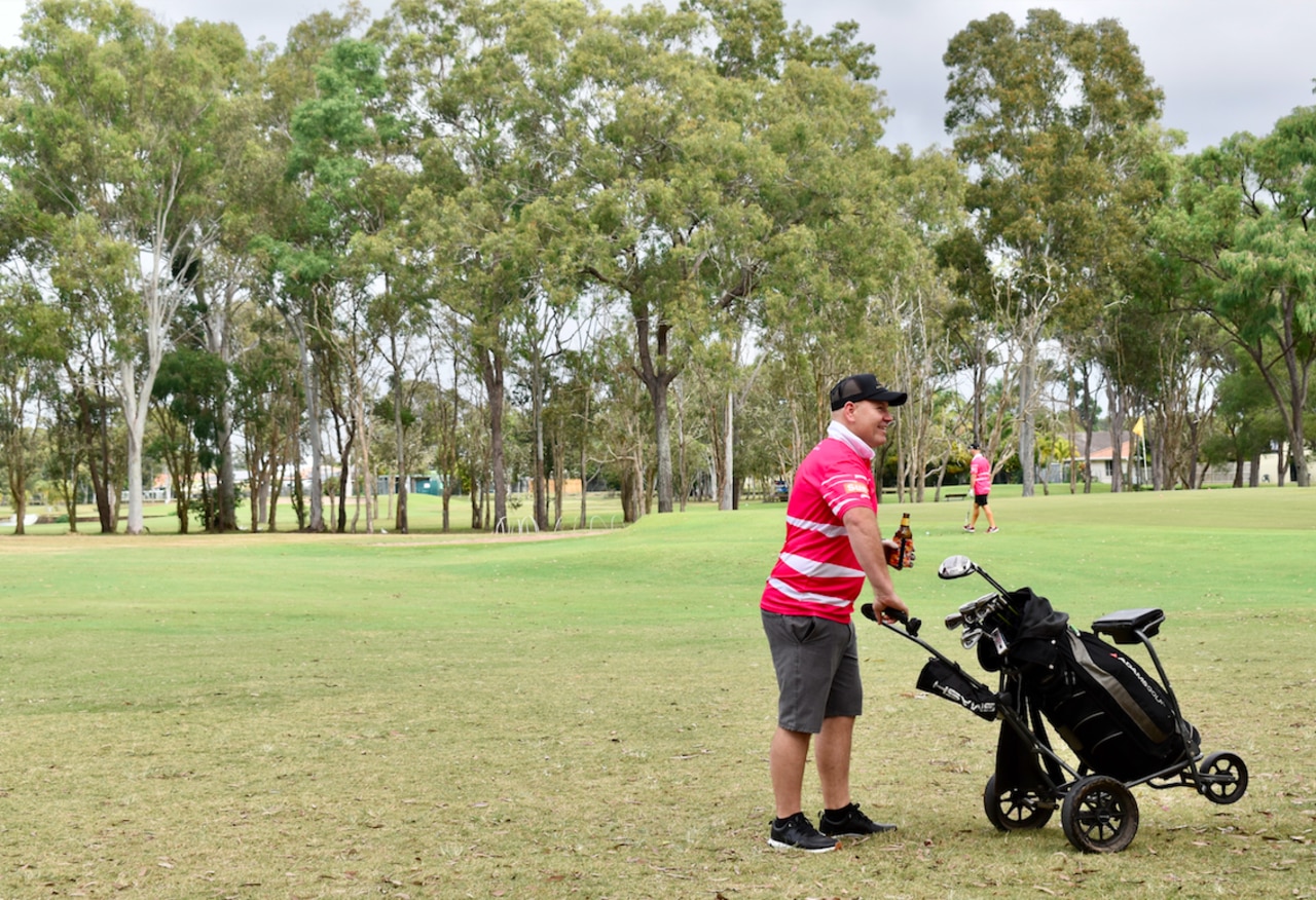 Beer in one hand, clubs in the other. Picture: Isabella Magee