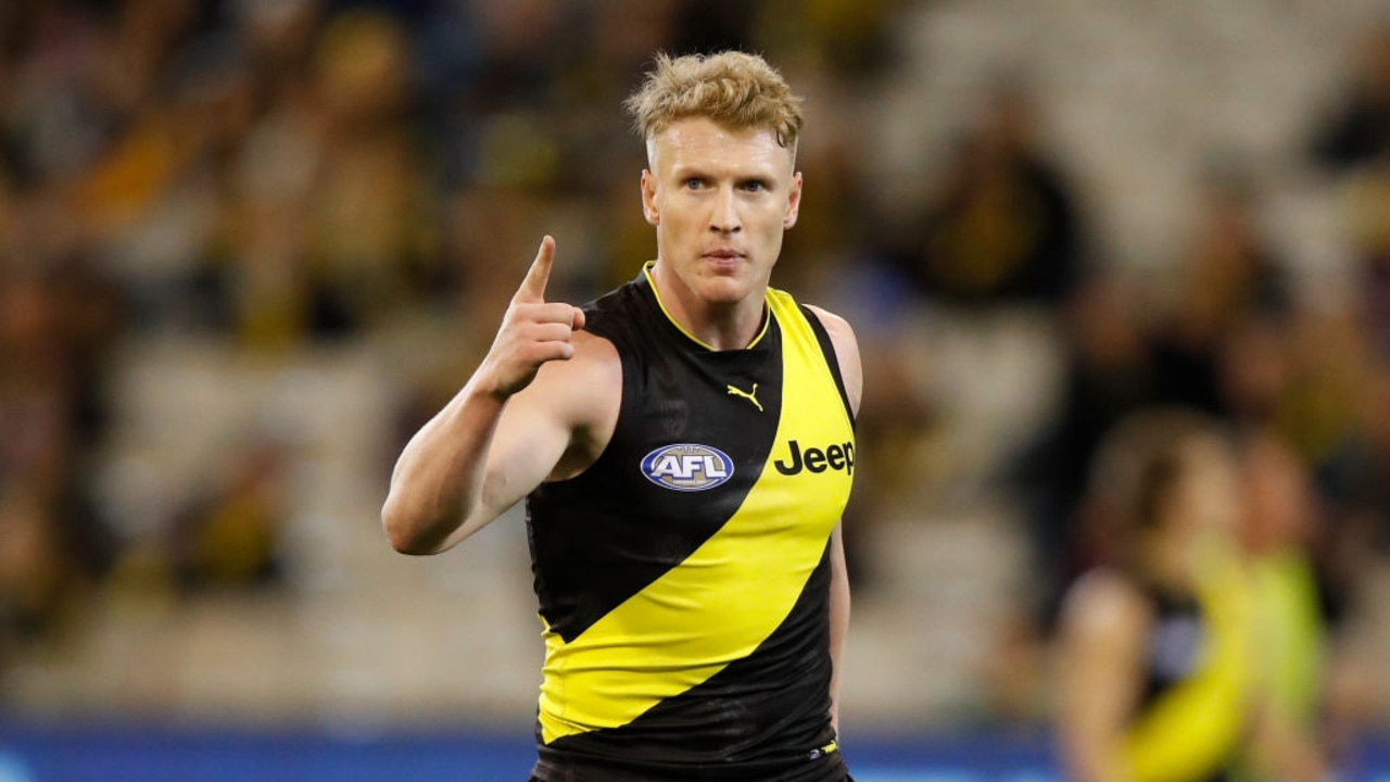 MELBOURNE, AUSTRALIA - JULY 06: Josh Caddy of the Tigers celebrates a score during the 2018 AFL round 16 match between the Richmond Tigers and the Adelaide Crows at the Melbourne Cricket Ground on July 06, 2018 in Melbourne, Australia. (Photo by Michael Willson/AFL Media/Getty Images)
