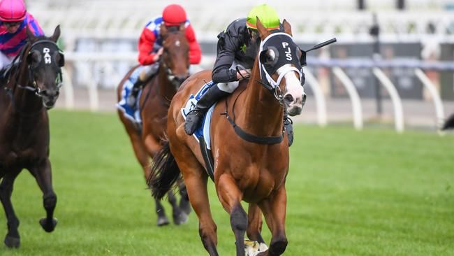 Defiant Dancer, ridden by Campbell Rawiller, wins sensationally at Flemington.