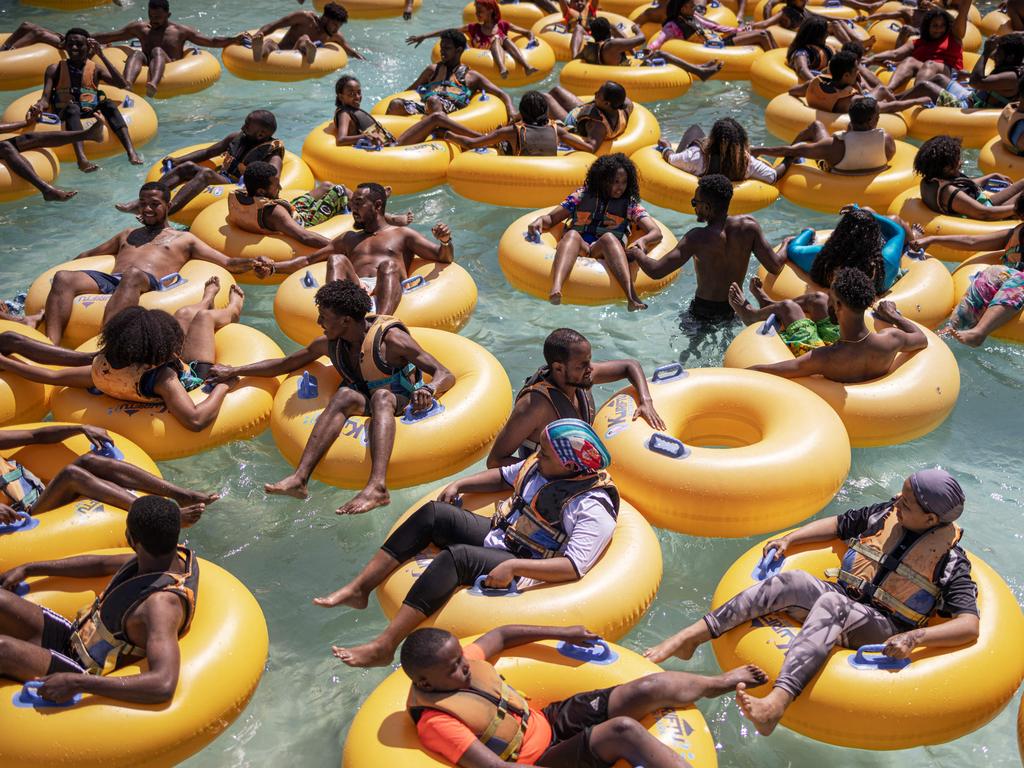 Holiday-makers relax in inflatable doughnuts at a water park in Bishoftu - one of Ethiopia’s premium leisure spots. Picture: Michele Spatari/AFP