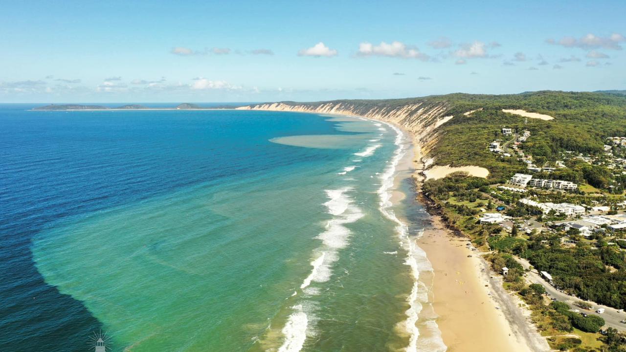 A stunning photo of the exposed rocks at Rainbow Beach taken by John Clough of Infinity Flights Photography and reproduced with their permission.