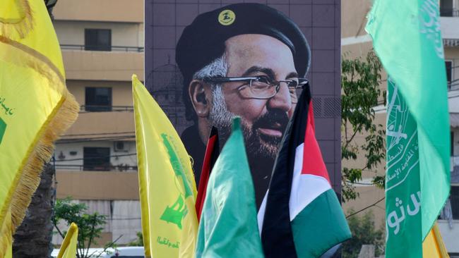 A portrait of slain Hezbollah military commander Fuad Shukr is displayed during a protest march in Sidon, Lebanon, on Friday Picture: Mahmoud Zayyat / AFP