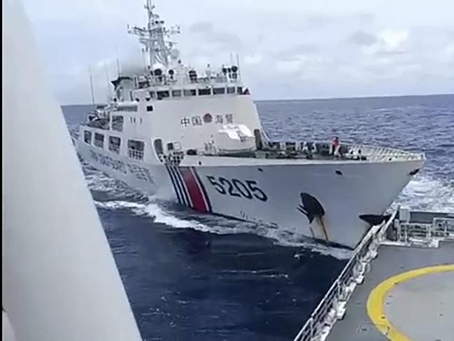 TOPSHOT - This frame grab from handout video footage taken and released on August 31, 2024 by the Philippine Coast Guard (PCG) shows a Chinese coast Guard ship (L) colliding with Philippine Coast Guard ship BRP Teresa Magbanua near the Sabina Shoal in disputed waters of the South China Sea. China and the Philippines accused each other on August 31 of deliberately ramming their coast guard ships near a flashpoint shoal in the South China Sea, the latest in a spate of similar incidents in recent weeks. (Photo by Handout / Philippine Coast Guard (PCG) / AFP) / RESTRICTED TO EDITORIAL USE - MANDATORY CREDIT "AFP PHOTO / PHILIPPINE COAST GUARD (PCG)" - NO MARKETING NO ADVERTISING CAMPAIGNS - DISTRIBUTED AS A SERVICE TO CLIENTS