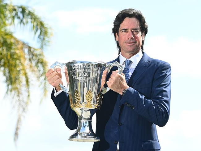 AFL Chief Executive Gillon McLachlan poses with the Premiership Trophy on the Gold Coast yesterday. Picture: Getty Images