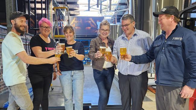 Clarence Nationals MP Richie Williamson (second from right) celebrates the expansion with the Sanctus Brewing Co team – brewer Dale Johnston, brand ambassador Renee Shepherd, co-owner Nicole O’Connor, brand ambassador Kim Geritz and co-owner Trent O’Connor.