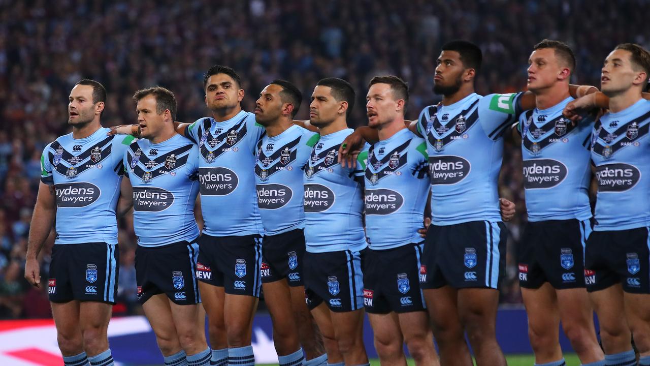 The Blues stand together for the national anthem. Picture: Cameron Spencer