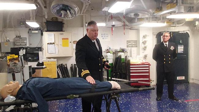 Dr and US Navy Lieutenant Commander Donald Trainer (left) and US Navy corpsman, Senior Chief Armando Leija in the medical bay on board the USS America. Picture: Jodie Munro O'Brien