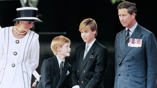 Prince Harry looks up at his dad Prince Charles in 1995. Picture: Johnny Eggitt / AFP